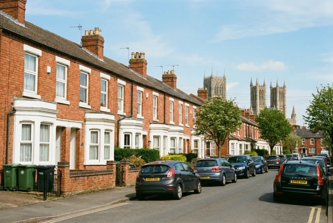 A Victorian terraced street in Lincoln's West End with the cathedral towers beyond the rooftops